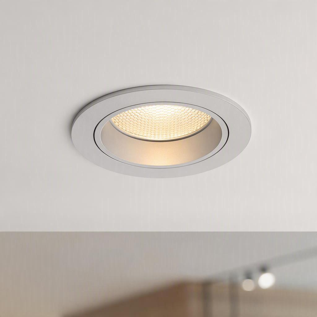 Modern recessed COB LED downlight with honeycomb anti-glare lens installed in a commercial ceiling